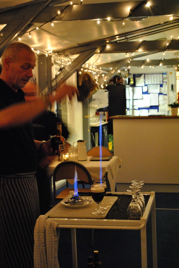 Kim prepares our Greenlandic coffee; the final step is adding flaming Grand Marnier.